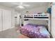 Bright bedroom with bunk bed, ceiling fan, and carpeted floors at 9189 Royal River Cir, Parrish, FL 34219