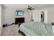 Bedroom with gray walls, carpeted floors, and a flat screen television at 9189 Royal River Cir, Parrish, FL 34219