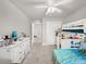 Bright bedroom with neutral walls, carpet, and a bunkbed and dresser at 9189 Royal River Cir, Parrish, FL 34219
