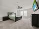 Serene bedroom with carpeted floors, ceiling fan, and stylish decor at 9189 Royal River Cir, Parrish, FL 34219