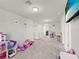 Upstairs bonus room provides flexible space for playroom at 9189 Royal River Cir, Parrish, FL 34219