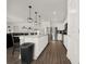 Kitchen with white cabinets, stainless steel appliances, and an island, creating a modern cooking space at 9189 Royal River Cir, Parrish, FL 34219