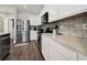 Modern kitchen with stainless steel appliances, stone countertops, and contemporary backsplash at 9189 Royal River Cir, Parrish, FL 34219