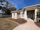 House entrance with columns, double doors and landscaping at 9373 Belvedere St, Spring Hill, FL 34608