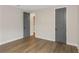 Neutral-toned bedroom with gray doors and hardwood floors at 111 S Cooper Pl, Tampa, FL 33609