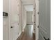 Clean hallway with light walls and wood flooring at 111 S Cooper Pl, Tampa, FL 33609