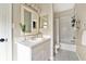 Clean bathroom with a shower/tub combo and white vanity at 2607 W Cleveland St # B, Tampa, FL 33609