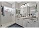 Spa-like bathroom with double vanity and walk-in shower at 2607 W Cleveland St # B, Tampa, FL 33609