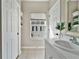 Bathroom with a single sink and a window overlooking courtyard at 2607 W Cleveland St # B, Tampa, FL 33609
