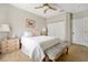 Bright bedroom with a double bed, dresser, and ceiling fan at 2607 W Cleveland St # B, Tampa, FL 33609