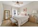 Bedroom with double bed, ceiling fan and a full-length mirror at 2607 W Cleveland St # B, Tampa, FL 33609