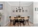 Dining room with a wood table and black chairs, and a chandelier at 2607 W Cleveland St # B, Tampa, FL 33609