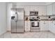 Modern kitchen with stainless steel appliances and white cabinets at 2607 W Cleveland St # B, Tampa, FL 33609