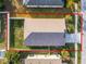Aerial view of house showing roofline and backyard at 30350 Grymes Dr, Wesley Chapel, FL 33545
