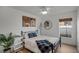 Bedroom with a metal bed frame, window, and wood floors at 30350 Grymes Dr, Wesley Chapel, FL 33545