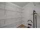 Spacious closet with wire shelving and clothing rack at 30350 Grymes Dr, Wesley Chapel, FL 33545