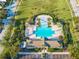 Community pool with surrounding lounge chairs and cabanas at 30350 Grymes Dr, Wesley Chapel, FL 33545