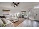 Living room featuring a sectional sofa, two armchairs, and a coffee table at 30350 Grymes Dr, Wesley Chapel, FL 33545