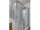Clean shower with glass enclosure and marble accents at 30350 Grymes Dr, Wesley Chapel, FL 33545