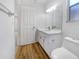 Clean bathroom with white vanity, toilet and flooring at 5220 Lords Ave, Sarasota, FL 34231