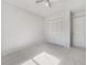 Simple bedroom with neutral walls and carpet flooring at 5220 Lords Ave, Sarasota, FL 34231
