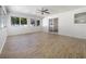 Spacious living area with light walls and wood-look floors at 5220 Lords Ave, Sarasota, FL 34231