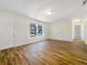 Spacious living area with hardwood floors and an open floor plan at 5220 Lords Ave, Sarasota, FL 34231