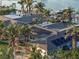 Aerial view showcasing home with solar panels and waterfront access at 8017 13Th S Ave, St Petersburg, FL 33707