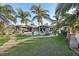 Landscaped backyard with pool and canal views at 8017 13Th S Ave, St Petersburg, FL 33707