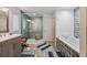 Large bathroom with soaking tub and walk-in shower at 8017 13Th S Ave, St Petersburg, FL 33707