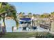 Private boat dock with lift and seating area at 8017 13Th S Ave, St Petersburg, FL 33707