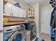 Bright laundry room, featuring washer, dryer, and ample storage at 8017 13Th S Ave, St Petersburg, FL 33707