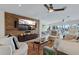 Spacious living room with large TV, comfortable seating and water views at 8017 13Th S Ave, St Petersburg, FL 33707