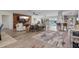 Spacious living area with hardwood floors, large TV, and water views at 8017 13Th S Ave, St Petersburg, FL 33707