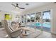 Living room with water views and access to pool area at 8017 13Th S Ave, St Petersburg, FL 33707