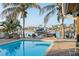Resort-style pool and patio with water views at 8017 13Th S Ave, St Petersburg, FL 33707
