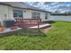 Back deck and sliding glass doors create an enjoyable space for outdoor living at 39567 Dawson Chase Dr, Zephyrhills, FL 33540
