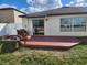 Back deck and sliding glass doors create an enjoyable space for outdoor living at 39567 Dawson Chase Dr, Zephyrhills, FL 33540