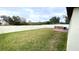 A large back yard with a white privacy fence surrounds this property with a deck at 39567 Dawson Chase Dr, Zephyrhills, FL 33540
