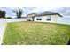 Home's backyard has wooden deck, large yard with a privacy fence at 39567 Dawson Chase Dr, Zephyrhills, FL 33540
