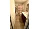 Well-lit bathroom with tile floor, dual sink vanity and a shower-tub combo at 39567 Dawson Chase Dr, Zephyrhills, FL 33540