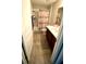Bathroom with a shower, cherry vanity, and tile floors at 39567 Dawson Chase Dr, Zephyrhills, FL 33540