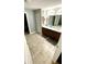 Spacious bathroom features double sink vanity, tile floors, and a separate room for the toilet and shower at 39567 Dawson Chase Dr, Zephyrhills, FL 33540