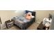 Cozy bedroom features plush carpeting and natural light from window at 39567 Dawson Chase Dr, Zephyrhills, FL 33540