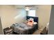 A bedroom with a ceiling fan, carpeted floors, and a full size bed at 39567 Dawson Chase Dr, Zephyrhills, FL 33540