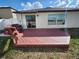 Enjoy outdoor living on this home's private backyard wooden deck at 39567 Dawson Chase Dr, Zephyrhills, FL 33540