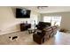 Living room with leather furniture, and neutral walls at 39567 Dawson Chase Dr, Zephyrhills, FL 33540