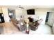 Spacious living room features tile flooring, comfortable seating and a mounted television at 39567 Dawson Chase Dr, Zephyrhills, FL 33540