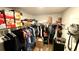 A walk-in closet with laminate floors, shoe racks, metal shelving, and black storage at 39567 Dawson Chase Dr, Zephyrhills, FL 33540