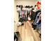 Organized walk-in closet featuring ample storage and hardwood flooring at 39567 Dawson Chase Dr, Zephyrhills, FL 33540